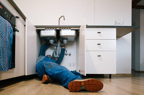 Professional Drain Cleaning technician working in Valley City, ND